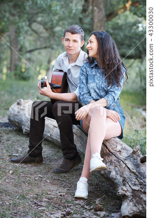young couple walking in the forest, romantic  43300030