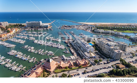 Aerial view of the bay of the marina, with luxury yachts in Vilamoura. 43300090