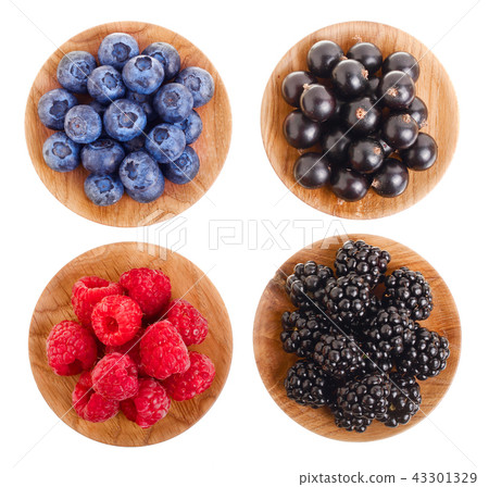 blackberry blueberry raspberry black currant in wooden bowl isolated on white background. Top view blackberry blueberry raspberry black currant in wooden bowl isolated on white background. Top view 43301329
