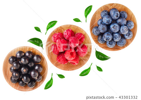 blueberry raspberry black currant in wooden bowl isolated on white background. Top view. Set or blueberry raspberry black currant in wooden bowl isolated on white background. Top view. Set or 43301332