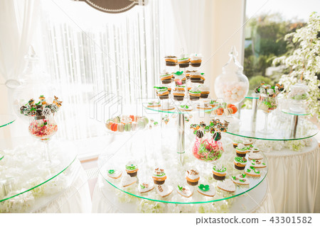 Different kinds of baked sweets on a buffet Different kinds of baked sweets on a buffet 43301582