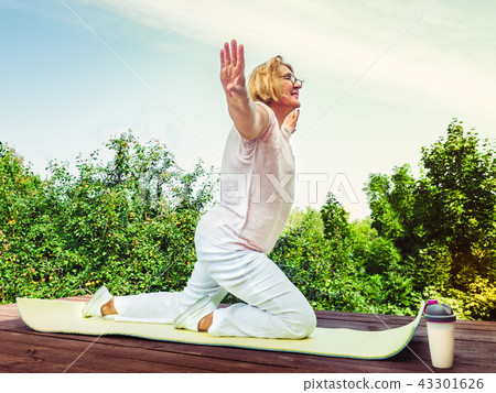 Cute, adult woman doing exercise in the park Cute, adult woman doing exercise in the park 43301626