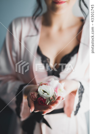 Gorgeous bride in robe posing and preparing for the wedding ceremony face in a room 43301745