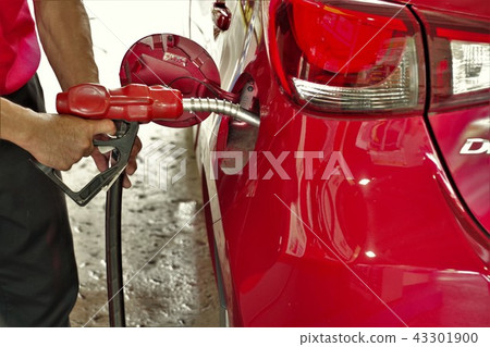 Gas station refueling full service clerk's hand 43301900