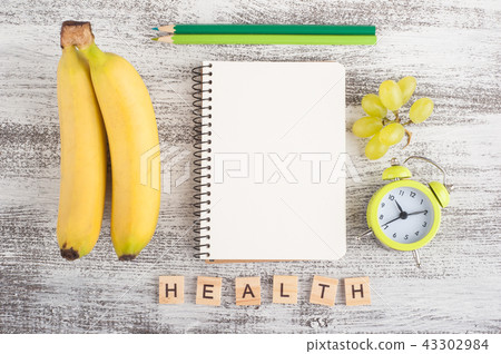 Empty notebook and fruits 43302984