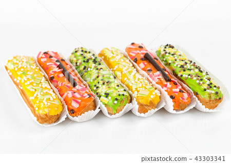 Sweet and colorful eclairs. Group of french dessert Eclair on white background. custard pastry 43303341