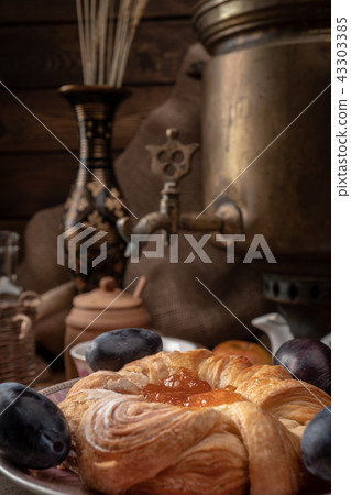 Breakfast with a samovar. Tea and cheesecake with jam 43303385