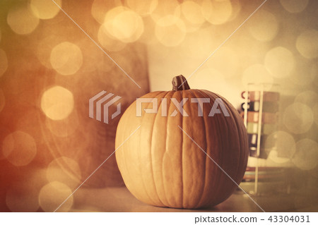 Autumn pumpkin on a table in kitchen Autumn pumpkin on a table in kitchen 43304031