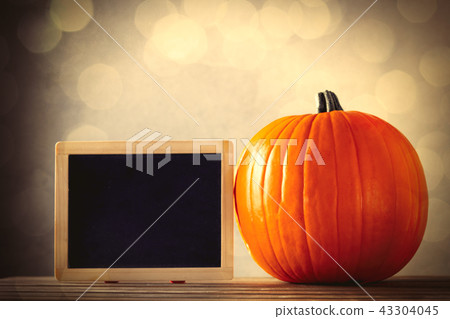 Fresh Autumn pumpkin and blackboard menu Fresh Autumn pumpkin and blackboard menu 43304045