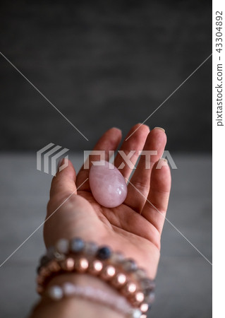 Woman holds yoni egg in hand Woman holds yoni egg in hand 43304892