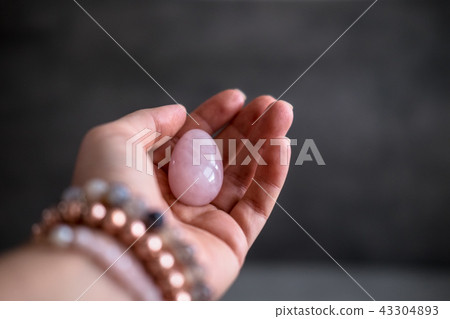 Woman holds yoni egg in hand 43304893