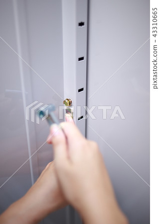 Do-it-yourself (body parts faceless do-it-yourself DIY driver assembling storeroom warehouse house construction) 43310665