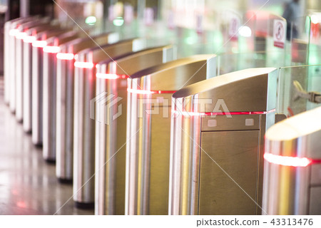 Glowing Turnstiles on an entrance to the subway 43313476