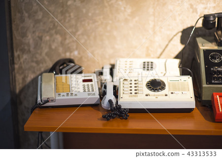 vintage telephone on table vintage telephone on table 43313533
