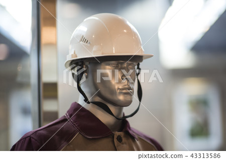 Man mannequin in protective clothes overalls and yellow helmet isolated over white background. Man mannequin in protective clothes overalls and yellow helmet isolated over white background. 43313586