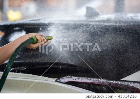 car washing with spray water 43314216