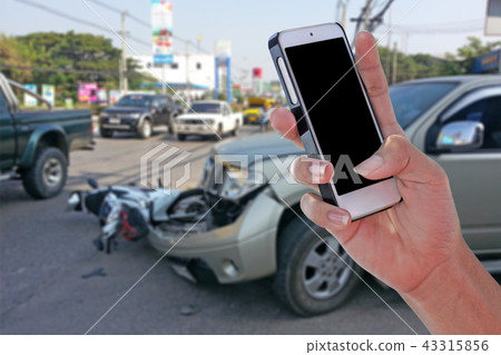 Man using phone at roadside after car accident Man using phone at roadside after car accident 43315856