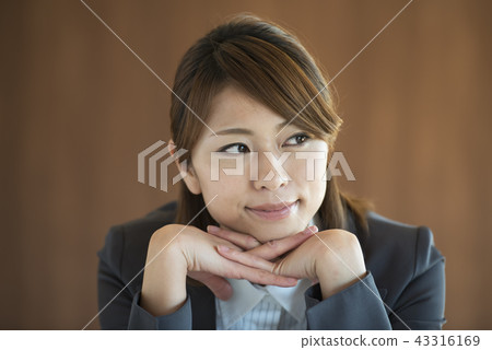 Businesswoman with a cheeks stick Businesswoman with a cheeks stick 43316169