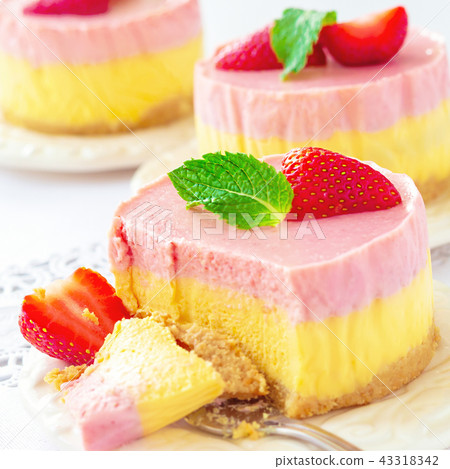 Delicious homemade mango strawberry cheesecake 43318342