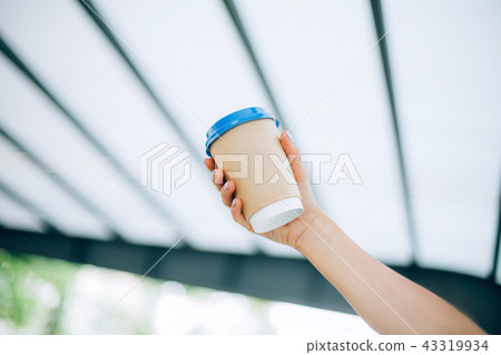 Hands with manicure and coffee cup with lines 43319934