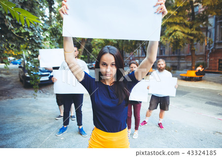 Group of protesting young people outdoors Group of protesting young people outdoors 43324185