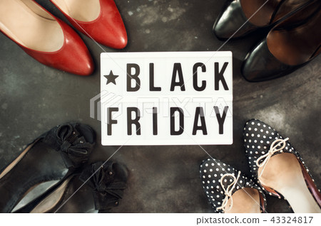 Black friday sale word on lightbox on dark table top view 43324817