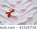 Minimalistic Photo of Plastic Spoons 43326738