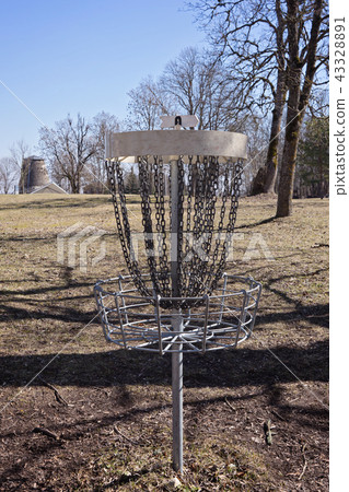 Empty Disc Golf Target on field Empty Disc Golf Target on field 43328891