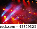 Several red stage lights in the dark 43329323