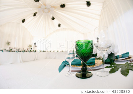 Beautiful banquet hall under a tent for a wedding reception. Interior of a wedding tent decoration 43330880