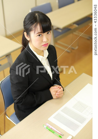 Female student job exam scene