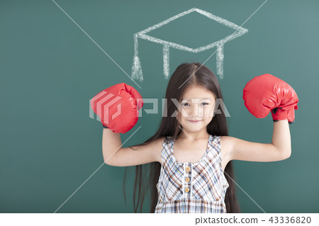 girl with boxing gloves and graduation concept girl with boxing gloves and graduation concept 43336820