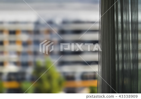 blurred view of building from the window 43338909