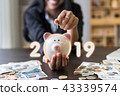 Successful business 2019.hands holding piggy bank. 43339574