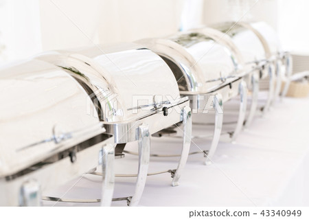 Many buffet trays ready for service. Breakfast at the hotel or buffet at the Banquet Many buffet trays ready for service. Breakfast at the hotel or buffet at the Banquet 43340949