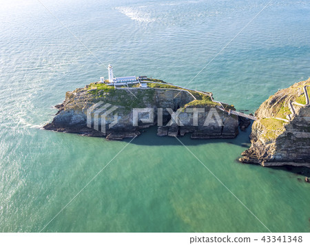 Aerial view of the beautiful cliffs close to the historic South Stack lighthouse on Anglesey - Wales 43341348