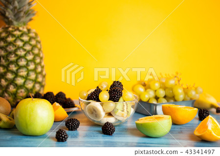 Ready for summer fruit variety on blue wooden desk Ready for summer fruit variety on blue wooden desk 43341497