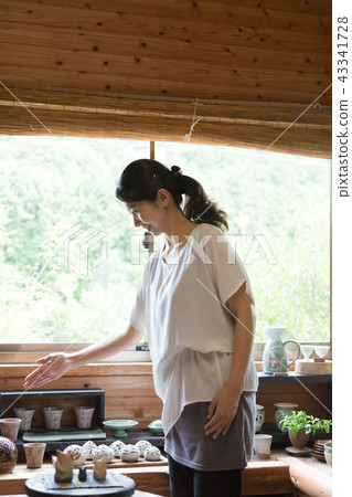 Female potter Female potter 43341728