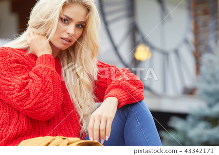 beautiful young blond woman spending time in the autumn scene beautiful young blond woman spending time in the autumn scene 43342171