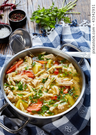 hot Chicken, pasta and vegetable rich soup 43342931
