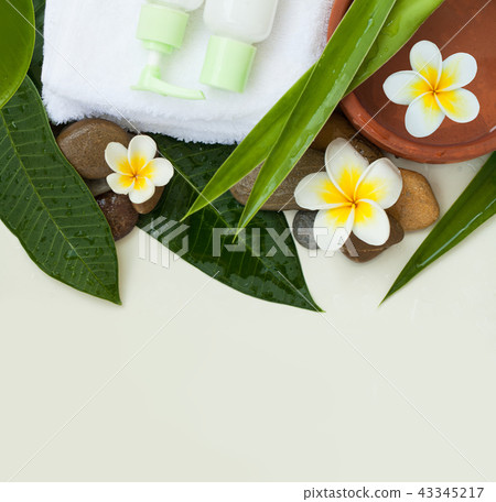 Tropical flowers, bowl of water, towel Tropical flowers, bowl of water, towel 43345217