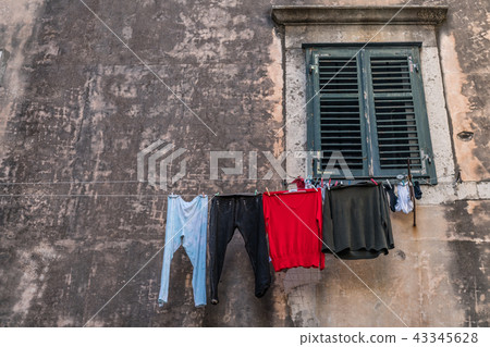 Laundry drying on a clothesline Laundry drying on a clothesline 43345628