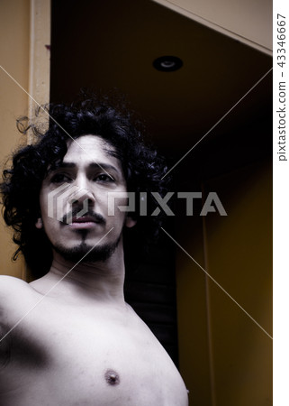 Portrait of latin man with beard and curly hair Portrait of latin man with beard and curly hair 43346667
