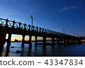 Night view of the wooden walkway with cityscape 43347834