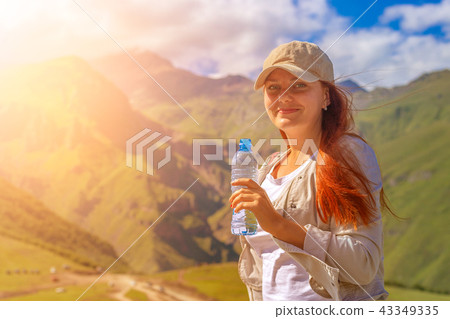 Woman drinking water in summer sunlight 43349335