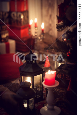 Christmas gifts and candles in lanterns Christmas gifts and candles in lanterns 43350511