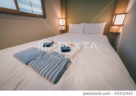 Japanese yukata and towel on bedroom in hotel 43352443