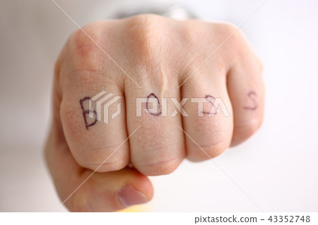 Male clenched fist in suit at office closeup 43352748