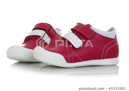 Little child red shoes isolated on white background 43352891