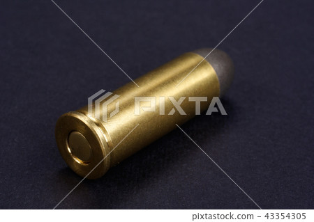 Wild West Revolver cartridges on black background Wild West Revolver cartridges on black background 43354305